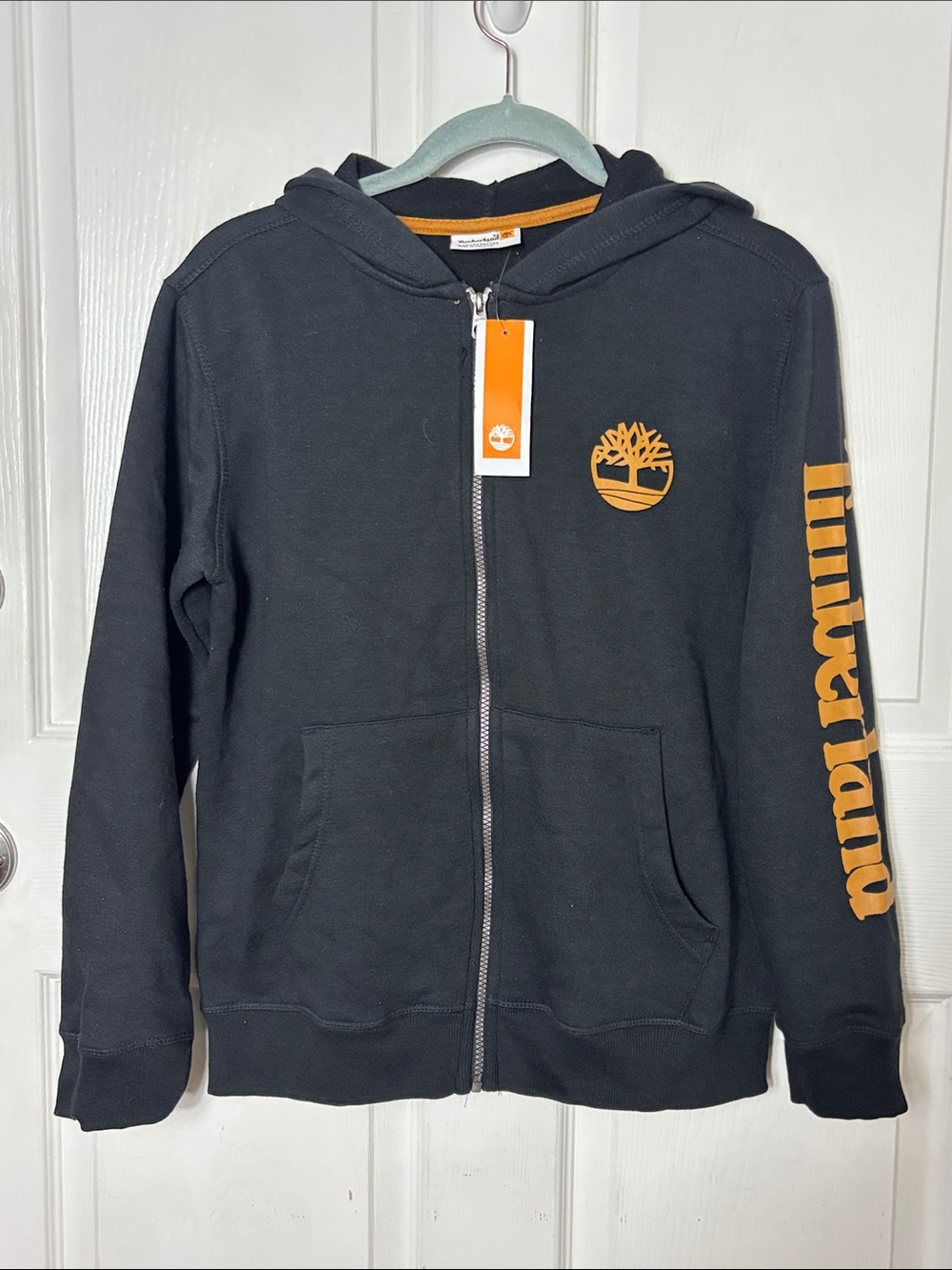 NEW Timberland Kids Black Zip Hoodie with Burt Orange Logo Sleeve Text Sz Large